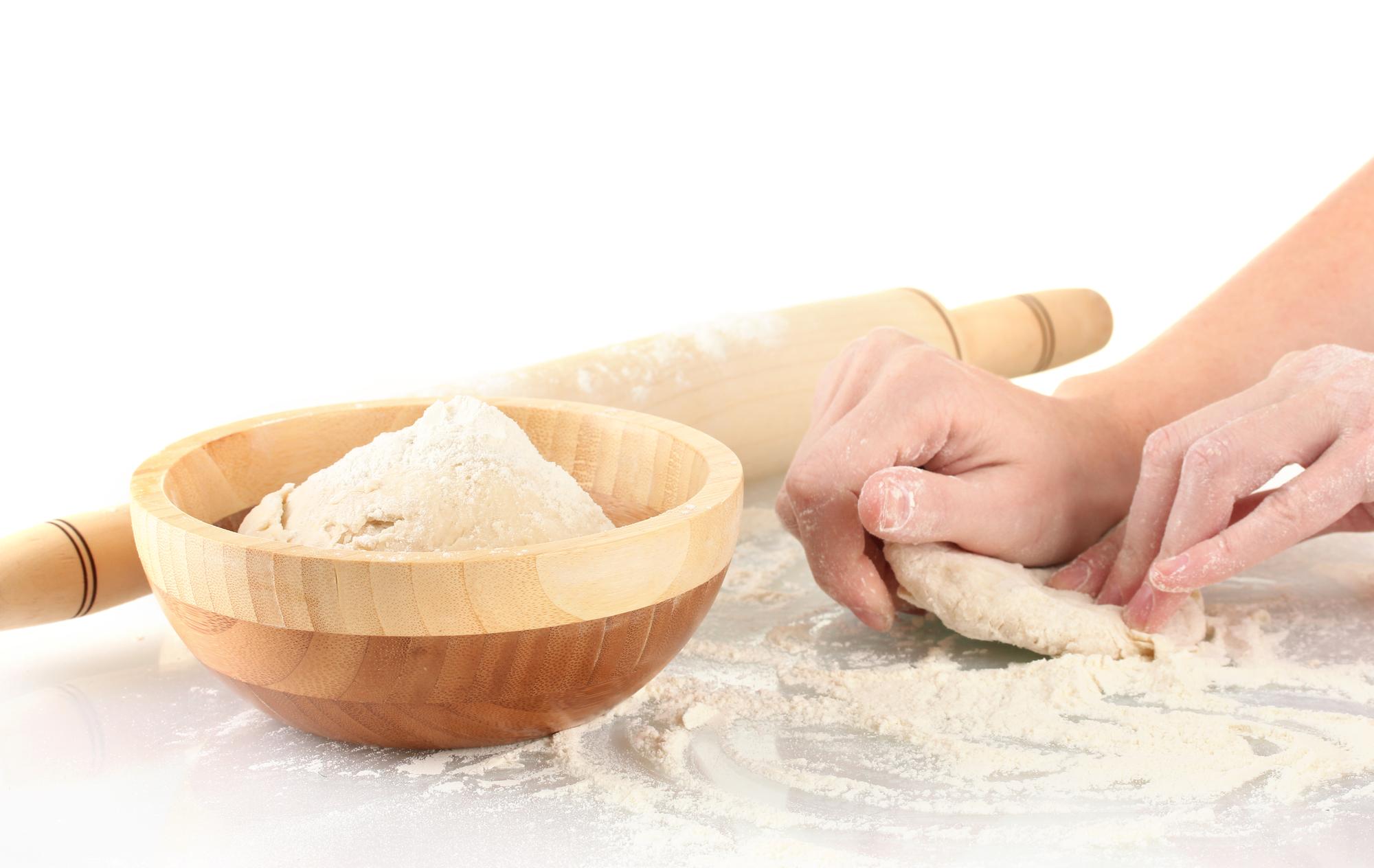 Student rolling dough in workshop